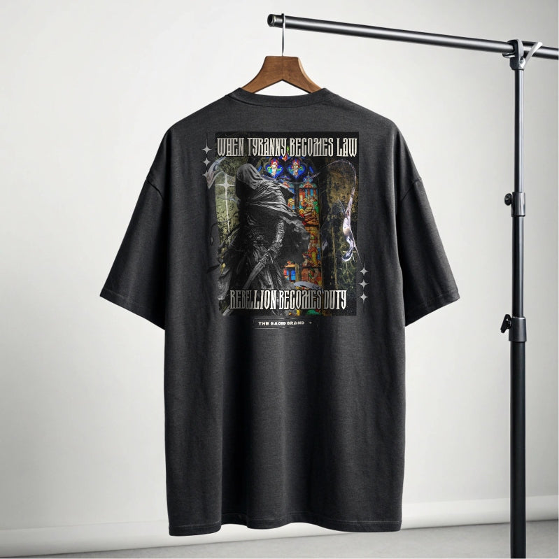When Tyranny Becomes Law, Rebellion Becomes Duty Oversized faded t-shirt